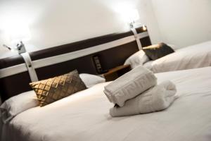 Voodi või voodid majutusasutuse HOSTAL LAS PALOMAS toas