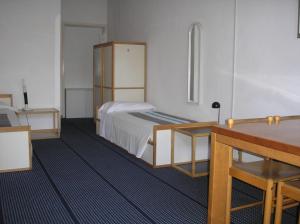 Postel nebo postele na pokoji v ubytování Doge Inn