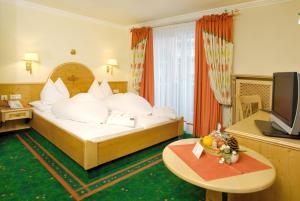 Ένα ή περισσότερα κρεβάτια σε δωμάτιο στο Boutique-Hotel Bauer