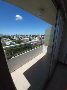 a room with a window with a view of a city at Hermoso Departamento Unico in La Plata