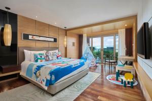 Voodi või voodid majutusasutuse Shenzhen Dameisha Kingkey Palace Hotel toas