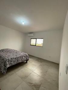a bedroom with a bed in a room with a window at Casa de las estrellas in Valles