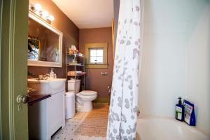 a bathroom with a toilet and a sink at Healthy Greenery - Urban Retreat in Rock Hill in Rock Hill