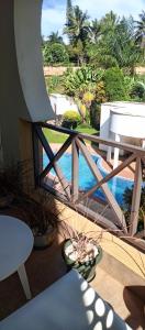 d'un balcon avec vue sur la piscine. dans l'établissement Luzira port bell lake side apartment, à Kampala