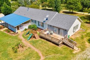 an aerial view of a house with a playground at Sovereign Cottage - Farm Land/Hot Tub/Outdoor Area in Fuquay-Varina