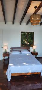 a bedroom with a large bed in a room at Willo's Treehouse in Escuintla