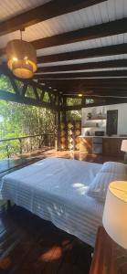 a bedroom with a large bed in a room at Willo's Treehouse in Escuintla