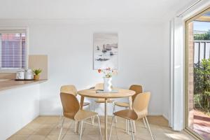 a dining room with a table and chairs at 3 Bdrms Duplex in Greystanes in Merrylands