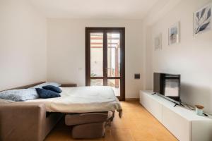 A bed or beds in a room at Casa Vacanze Albarìa