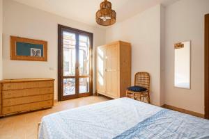 A bed or beds in a room at Casa Vacanze Albarìa