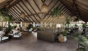 un vestíbulo con mesas, sillas y palmeras en Villa Haven Maldives Resort en Maamigili