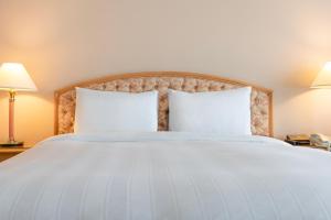 Postel nebo postele na pokoji v ubytování Lotte Hotel Busan