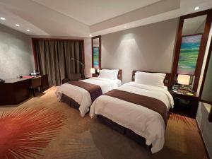 Postel nebo postele na pokoji v ubytování Baolong Hotel Shanghai + 31 fotografií
