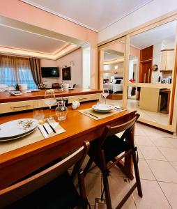 a dining room with a table and a kitchen at Dreamy Luxury Studio in Nafpaktos +54 photos