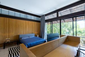 Postel nebo postele na pokoji v ubytování Khaoyai Kirimaya Atta Residence 5 BR Villa