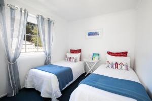 Ένα ή περισσότερα κρεβάτια σε δωμάτιο στο Beach Paradise Family Friendly Close to Beach
