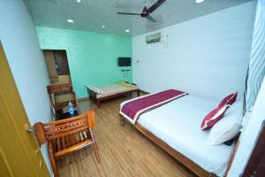 Ένα ή περισσότερα κρεβάτια σε δωμάτιο στο SIPAYI RESORT COORG