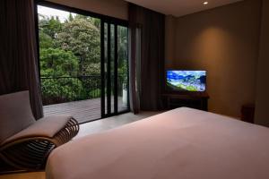 TV a/nebo společenská místnost v ubytování The Ning Resort Ubud
