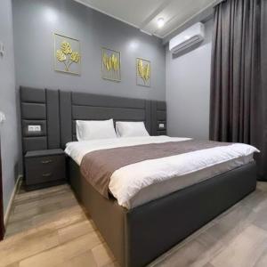 a bedroom with a large bed in a room at Dayssin Boutique hotel in Yerevan