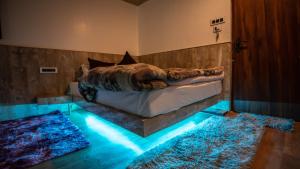 Postel nebo postele na pokoji v ubytování Darjeeling Guest House Deluxe