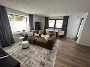 a living room with a couch and a table at Bergerwachen in Berchtesgaden