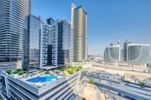 a view of a city with tall buildings at 1BR + maid room Apartment in Downtown Dubai in Dubai