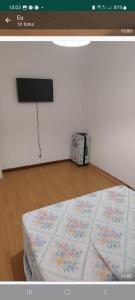 a room with a bed with avertisement at H5J - APT in Vila Nova de Gaia