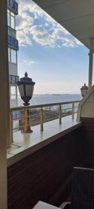 a balcony with a view of the ocean at Emirhan Palace Hotel in Istanbul