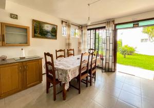 a kitchen and dining room with a table and chairs at 3 bedroom Villa - Private and Spacious in Pointe aux Canonniers