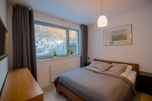 Llit o llits en una habitació de Apartview Bukowa Apartments by Rent like home