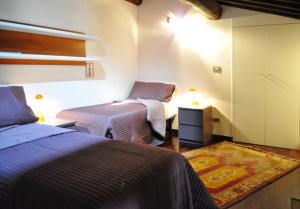 A bed or beds in a room at Casa Vacanze Mazzanti