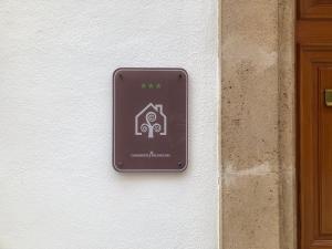 a sign on a wall next to a door at Casa Señorial Benissa in Benissa