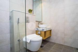 a bathroom with a toilet and a sink and a shower at Elegant Studio at Aykon City Tower - C in Dubai