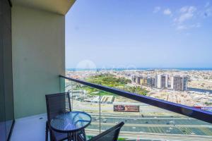 a balcony with a view of a city at Elegant Studio at Aykon City Tower - C in Dubai