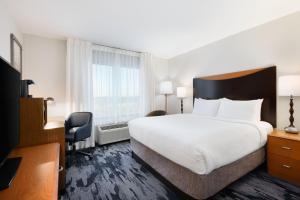 a hotel room with a large bed and a window at Fairfield Inn & Suites Fort Pierce / Port St Lucie in Fort Pierce +31 photos