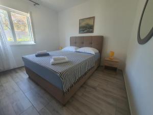 Postel nebo postele na pokoji v ubytování Apartment Marija Marina