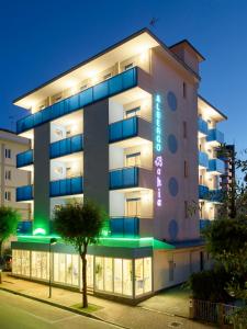 a building with lights on the side of it at Hotel Bahia in Lignano Sabbiadoro