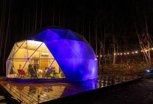 a dome tent is lit up at night at KURA Nagomi Hida Takayama - Camp - Vacation STAY 62749v in Takayama