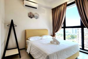 Giường trong phòng chung tại Urban Muji Retreat Suites #3BR #2carparks +60 ảnh
