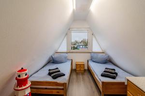 Ένα ή περισσότερα κρεβάτια σε δωμάτιο στο Ferienhaus Schmidt