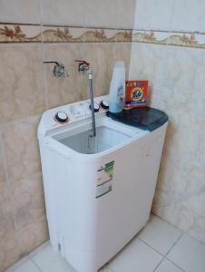 a bathroom with a sink on top of a tank at Soma Apt in Medina