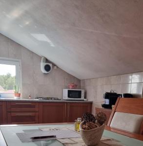 a kitchen with a bowl of food on a table at Casa da Oliveira in Pegarinhos