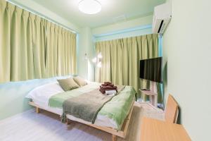 Krevet ili kreveti u jedinici u okviru objekta Azabukumai building