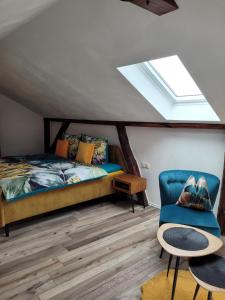 a bedroom with a bed and a skylight at FeWo Todeskino ``Altstadtflair`` in Heiligenhafen in Heiligenhafen