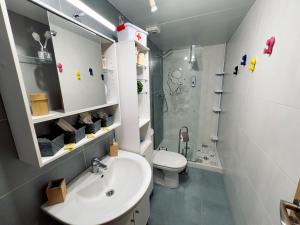 a bathroom with a sink and a toilet and a shower at V.T. Entreríos in Lardero