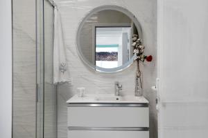 a bathroom with a sink and a mirror at El Pasero in El Golfo
