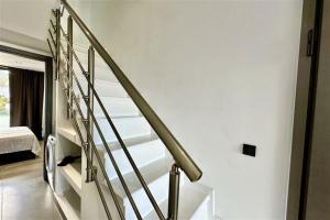 A bed or beds in a room at White Lion Apartment Kallithea 1