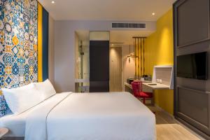 Postel nebo postele na pokoji v ubytování Ibis Styles Phuket City