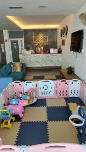a living room with a play area with a bed and toys at Big Big Hotel in Johor Bahru