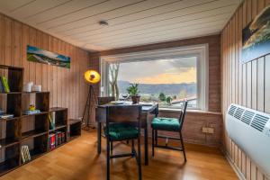 a room with a table and chairs and a window at Haus Dina in Bodenwerder